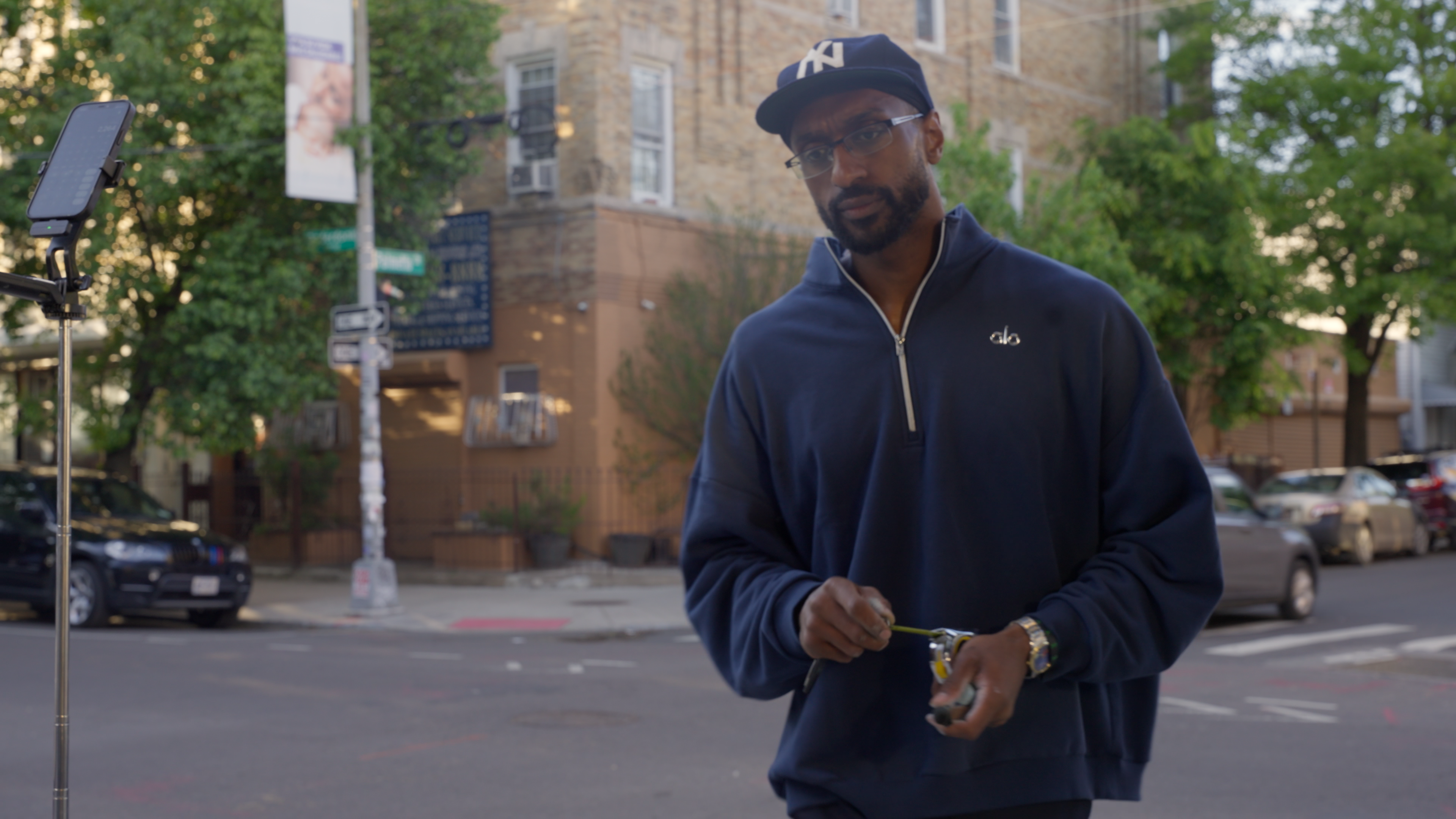 A man being interviewed on a Brooklyn street corner